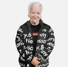 an elderly woman is wearing a black jacket that says y.b. on it