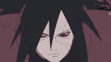 a close up of a cartoon character with red eyes and black hair .