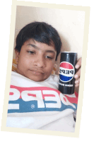 a boy in a pepsi shirt holds a can