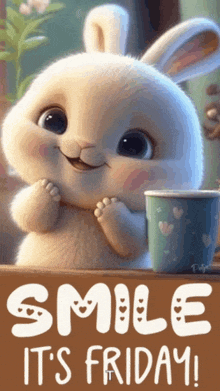 a bunny with a cup of coffee and the words smile it 's friday on the bottom