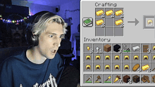 a man wearing headphones next to a screen that says crafting inventory