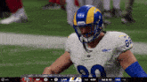 a football player wearing a helmet with rams on it