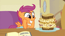 a cartoon pony sits at a table with a book and a cake