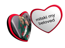 two hearts that say mitski my beloved with a picture of a girl