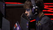 a man wearing headphones and a shirt that says ca