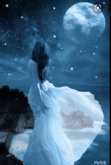 a woman in a white dress is standing in front of a blue moon