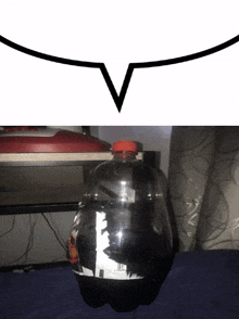 a bottle of soda sits on a table next to a speech bubble with the letter v on it