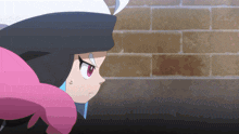 a cartoon character with a black hat and pink hair stands in front of a brick wall