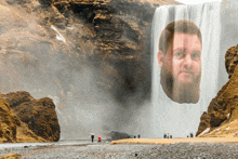 a waterfall with a man 's face in the middle of it