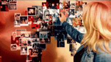 a woman in a denim jacket is pointing at a collage of pictures