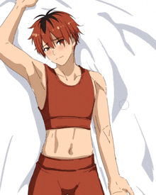 a man with red hair is laying on a white sheet