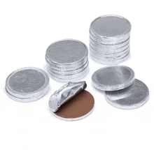 a stack of silver coins with one being open