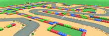 a blurred image of a race track with a lot of colored blocks