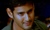 a close up of a man 's face with his eyes closed