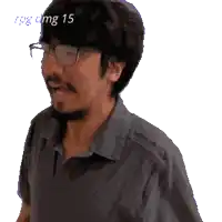 a pixelated image of a man with a beard and glasses says img 15 on the top