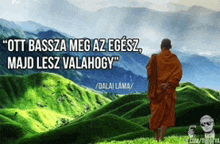 a man in an orange robe stands in front of a mountain with a quote from dalai lama