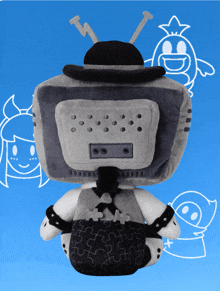 a stuffed toy that looks like a television with a hat on it