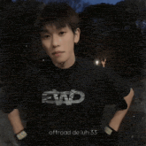 a man wearing a black shirt with the number 30 on it