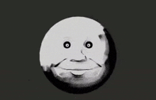 a black and white drawing of a cartoon moon with a face .