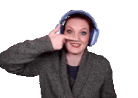 a woman wearing headphones and a sweater is making a funny face