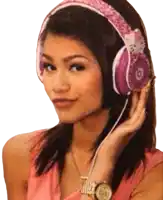 a woman wearing pink hello kitty headphones