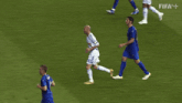 soccer players on a field with the word fifa on the bottom right