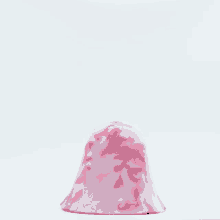 a pink and white item with a white background