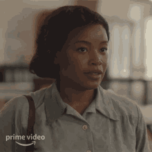 a woman in a blue shirt is featured in a prime video advertisement