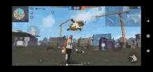 a person is playing a video game on a cell phone and a helicopter is flying overhead .