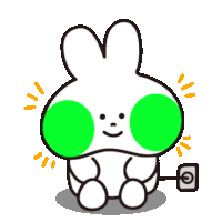 a cartoon bunny with green spots on its face is sitting next to an outlet