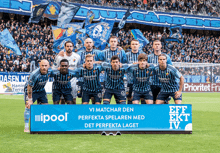 a group of soccer players pose for a team photo