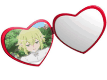 a heart shaped mirror with a picture of a girl