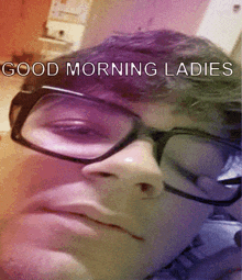 a man wearing glasses says good morning ladies on the bottom