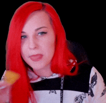 a woman with red hair is wearing a black and white shirt that says blackcraft on it