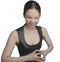 a woman wearing a black tank top is making a funny face
