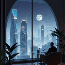 a man sits at a table in front of a window overlooking a city