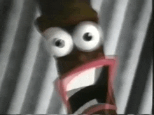 a close up of a cartoon character 's face with a surprised look on his face .