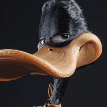 a close up of a cartoon duck with a black mask