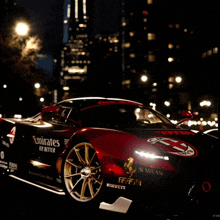 a red and black sports car with emirates fly better on the side