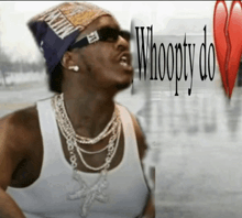a man wearing sunglasses and a bandana with the words whoopty do on it