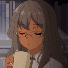 a girl with glasses is drinking from a cup with her eyes closed