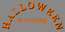 a sign that says halloween is coming in orange on a gray background