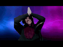 a woman in a black hoodie is dancing with the word cheh in the background