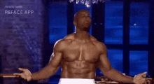 a shirtless man is standing in front of a window with his arms outstretched in a reface app video .
