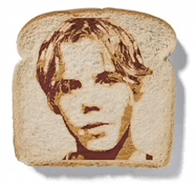 a slice of bread has a picture of a young man on it