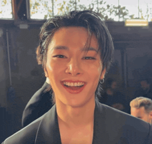 a close up of a person 's face with a smile