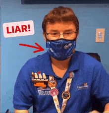 a man wearing a blue shirt that says legoland builder