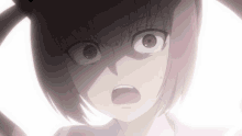 a close up of a girl 's face with a surprised expression