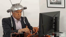 a man sitting at a desk with a sassy justice sign