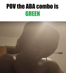 a man wearing a headset with the words pov the aba combo is green